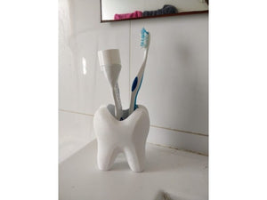 A cup for toothbrush and toothpaste